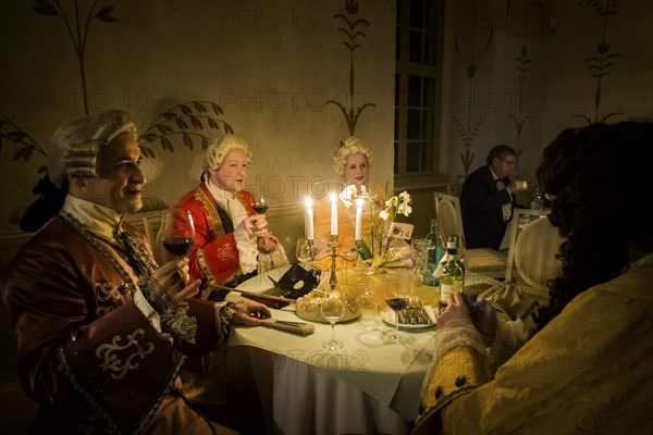 Masquerade ball at Rammenau Baroque Palace, Rammenau Palace in Rammenau near Bischofswerda in the district of Bautzen is one of the most beautiful preserved Baroque country palaces in Saxony. The les danseurs de Sans Souci as guests at the masked ball. With their historical dances, the costumed performers were a highlight of the evening