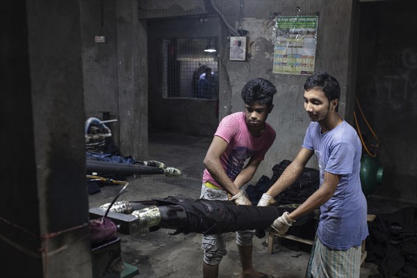 Worker in a denim dyeing factory, textile industry, Dhaka, Bangladesh, Asia