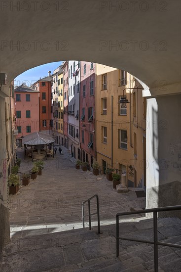 Colourful houses in Piazza Truogoli di Santa Brigada, below one of the few remaining public wash houses built in 1656, Genova, Italy, Europe