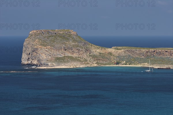 Venetian sea fortress Gramvoussa, sailboat, peninsula Gramvoussa, pirate bay, Balos, Tigani, blue cloudless sky, West Crete, island Crete, Greece, Europe