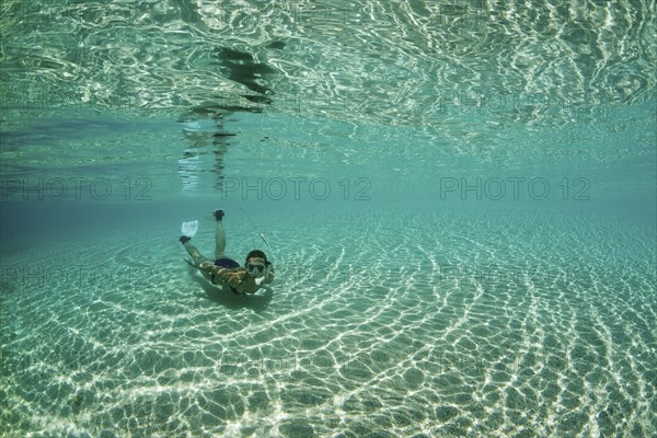 Snorkelling in lagoon, Fadol, Kai Islands, Moluccas, Indonesia, Asia