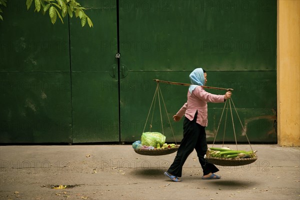 Central hanoi vietnam street woman food vendor