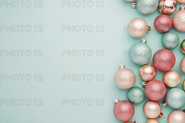 Christmas flatlay with blue and pink colored tree baubles on pastel background with copy space. Generative Ai, AI generated