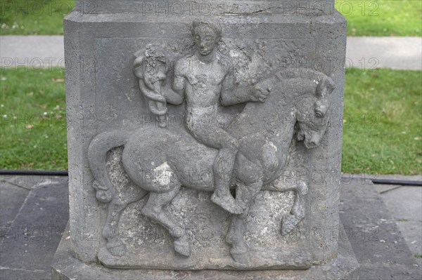 Horseman with escolab staff, relief on the monument to the Rakoczy spring discoverers Balthasar Neumann and Georg Anton Boxberger, spa garden, Heilbad Kissingen, Bad Kissingen, Lower Franconia, Bavaria, Germany, Europe