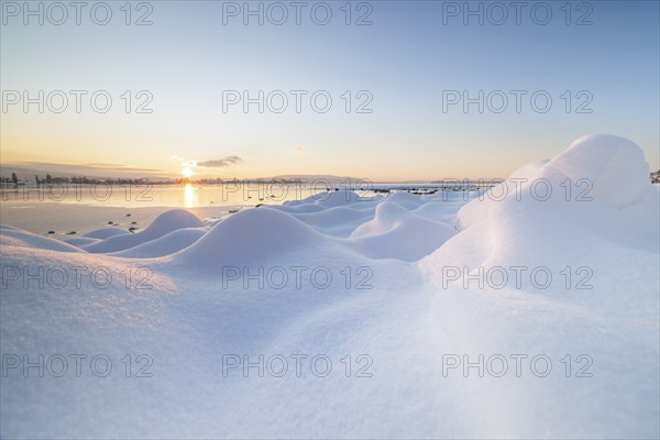 Winter snow cover with hills and a lake at sunrise, frosty atmosphere, Seegarten, Allensbach, Lake Constance, Baden-Württemberg, Germany, Europe