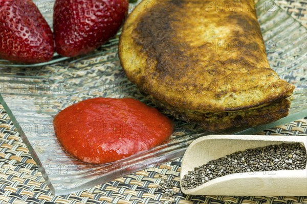 Banana, egg and chia seed pancakes with strawberry puree