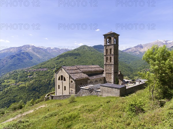 Aerial landscape with old church near Como lake between mountains in Italy