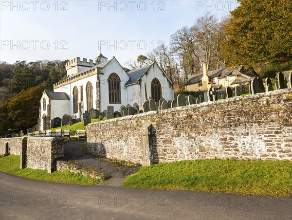 The Church of All Saints Selworthy, Somerset, England a whitewashed 15th-century building with a 14th-century tower