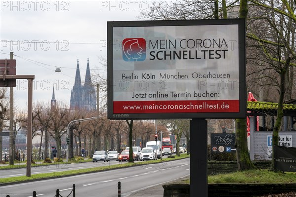 LED billboard, with digital advertising for Corona rapid tests, in the test centre in Cologne, on Konrad-Adenauer-Ufer in Cologne, North Rhine-Westphalia, Germany, Europe