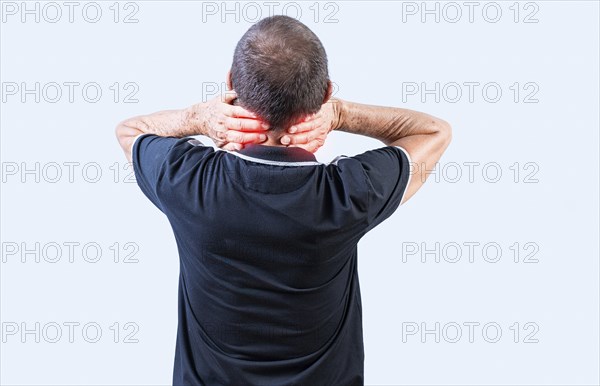 Rear view of Mature man with neck tension isolated. People suffering with neck pain isolated. Neck pain and stress concept