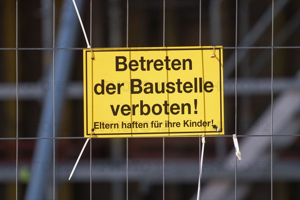 Construction site, signs indicating safety regulations, entering the construction site prohibited, occupational health and safety