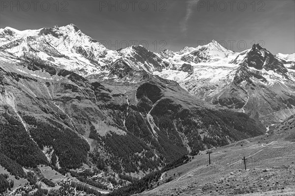 Alpine meadows at the summit of Corne de Sorebois, behind the snow-covered peaks of Weisshorn, Bishorn, Zinalrothorn and Obergabelhorn, black and white photo, Val d'Anniviers, Valais Alps, Canton Valais, Switzerland, Europe