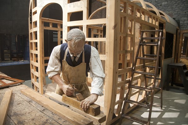 Mannequin of a carpenter in the carriage making section of Steam museum of the Great Western Railway, Swindon, England, UK