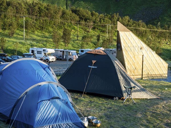 Golden restroom at beach Ersfjordstranden, fjord Ersfjord, public recreation area, camping, mobile homes stay overnight, tents, island Senja, Troms, northern Norway, Norway, Europe