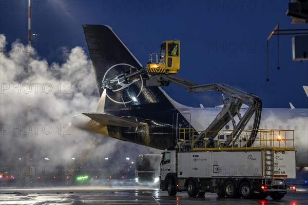 Winter at Frankfurt Main Airport, FRA, Lufthansa aircraft being de-iced by de-icing vehicles, Hesse, Germany, Europe