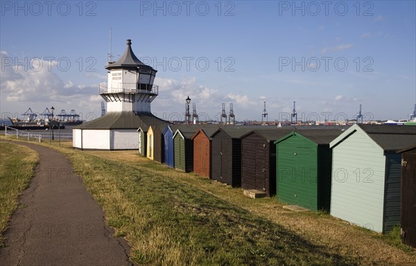 Colourful seaside beach huts and Low lighthouse maritime museum, Harwich, Essex, England, United Kingdom, Europe