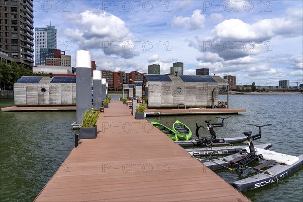 Floating hotel rooms, Wikkelboat in the Rijnhaven, the Rijnhaven, a 28-hectare harbour basin, has now been filled in by almost a third to create space for up to 3, 000 flats, there will be an artificial beach, a floating park connected by jetties, restaurants and shops, cultural facilities, a major urban development project in the old harbour, the Rijnhaven borders on the popular Kop van Zuid and Katendrecht districts, Rotterdam, Netherlands