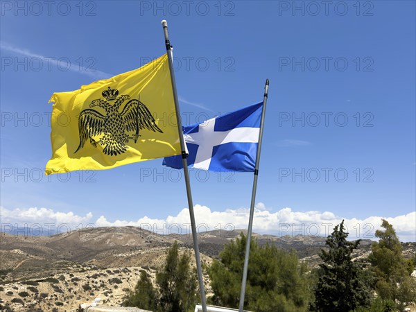 Front mirror-inverted reverse of flag Flag with symbol of Eastern Orthodox Greek Orthodox Church yellow background in black black imperial Byzantine double-headed eagle Byzantine Empire of Palaiologian Dynasty Insignia of Byzantium Crown Sword Orb Globe behind National flag of Crete, Unesco Site Site Orthodox Greek Orthodox Monastery Moni Odigitria, Festos, Crete, Crete