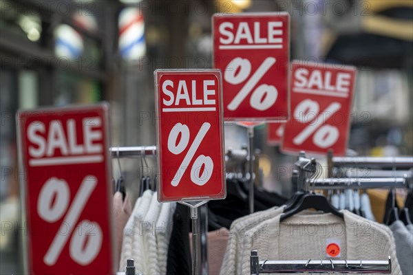 Sale, special offers of a clothing shop in the pedestrian zone, in Duisburg, North Rhine-Westphalia, Germany, Europe