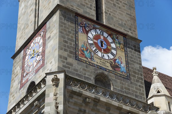 Close-up of a church tower with a large clock and colourful frescoes, Black Church, Old Town, Brasov, Brasov, Transylvania, Romania, Europe