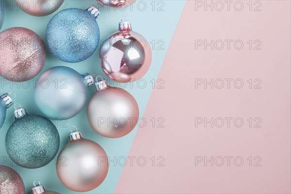 Christmas flatlay with blue and pink colored tree baubles on pastel background with copy space. Generative Ai, AI generated