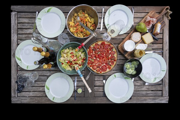 Garden table set with salads, a quiche and cheese platter, Bavaria, Germany, Europe