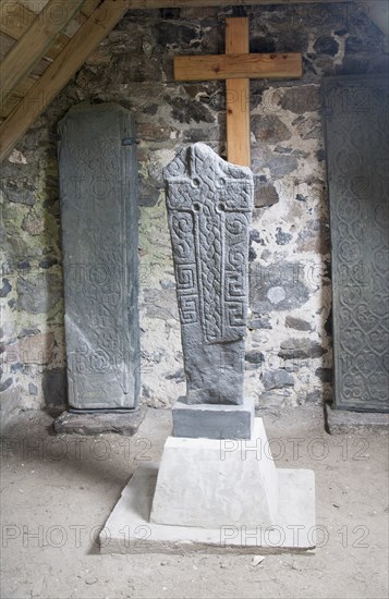 Replicas of ancient Celtic Christian crosses inside Cille Bharra chapel, Eoligarry, Barra, Outer Hebrides, Scotland, UK