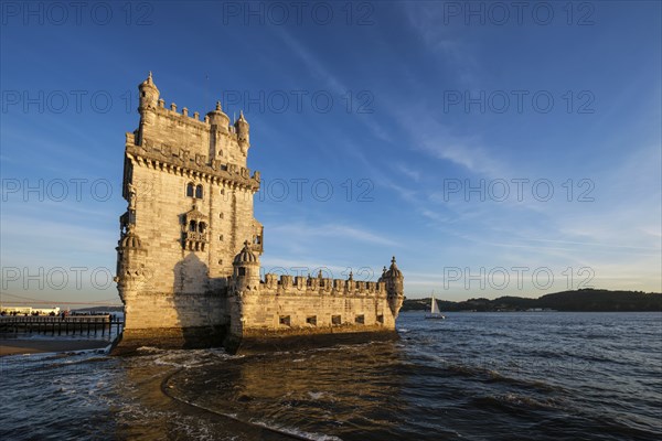 Belem Tower or Tower of St Vincent, famous tourist landmark of Lisboa and tourism attraction, on the bank of the Tagus River Tejo on sunset. Lisbon, Portugal, Europe