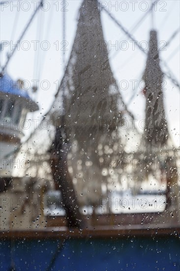 View through a window with raindrops on a shrimp boat, Oudeschild, Texel, West Frisian Islands, North Holland, Netherlands