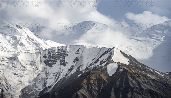 Dramatic mountain landscape, mountain valley, behind glaciated and snow-covered mountain peak Pik Lenin, Trans Alay Mountains, Pamir Mountains, Osh Province, Kyrgyzstan, Asia