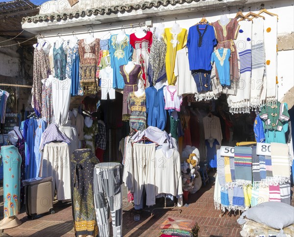 Textiles and clothes hanging oustide shop in medina area of Essaouira, Morocco, north Africa, Africa