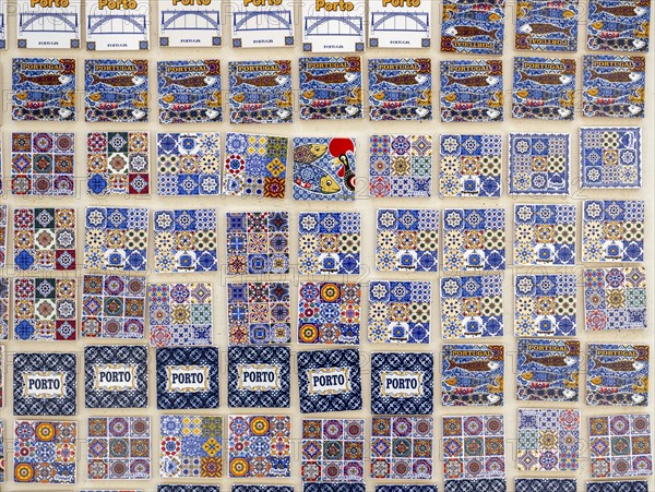 A display of ceramic fridge magnets, modeled after the iconic azulejo tiles, for sale in Porto, Portugal, Europe