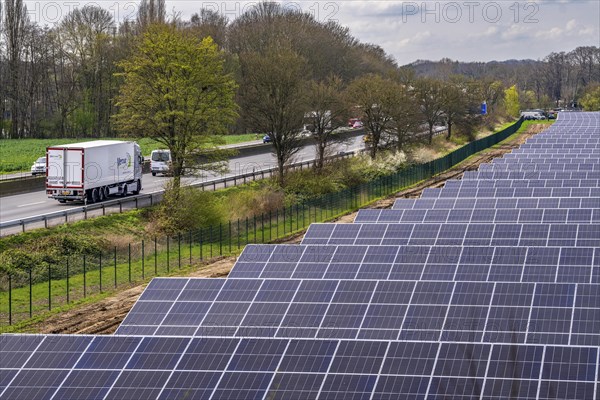 Solar park near Neukirchen-Vluyn, along the A40 motorway, over 10, 000 solar modules spread over 4.2 hectares, generating 6 million kilowatt hours per year, North Rhine-Westphalia, Germany, Europe