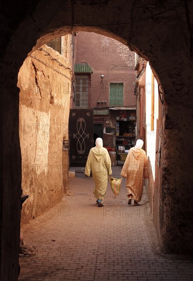 2 woman in an old town alley in the Medina, Marrakech, Morocco, Africa