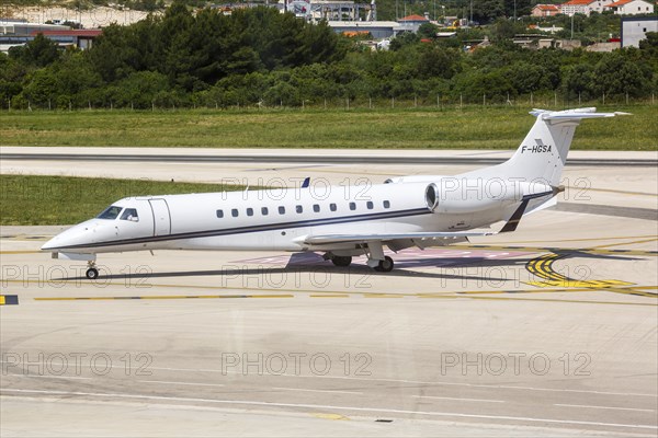 An Embraer 505 Phenom 300 aircraft of VallJet with the registration number F-HGSA at Split Airport, Croatia, Europe