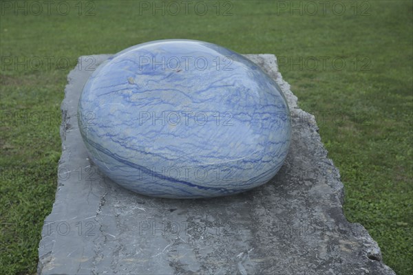 Sculpture stone drop by Livia Kubach and Michael Kropp 2024, oval blue quartz, stone, smooth, cut, polished, surface, marbled, oval, blue, large gemstone, stone sculpture park, Ebernburg, Bad Münster am Stein-Ebernburg, Bad Kreuznach, Rhineland-Palatinate, Germany, Europe