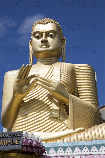 Giant Golden Buddha statue at Dambulla cave temple complex, Sri Lanka, Asia