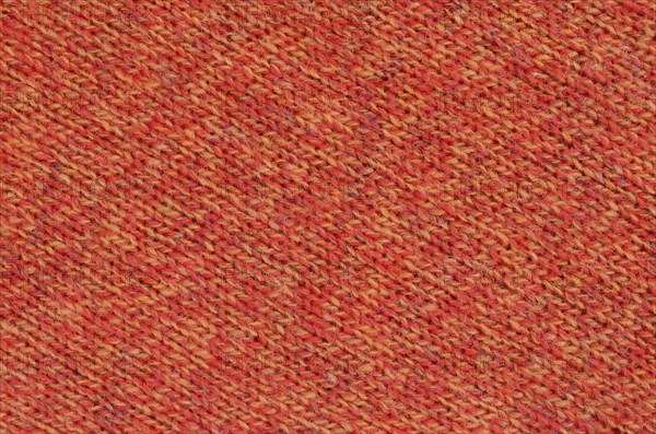 Abstract Background Texture Of Knitted Orange Wool Fabric