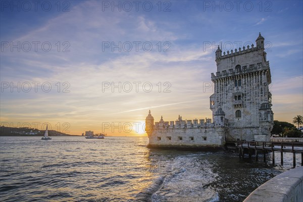 Belem Tower or Tower of St Vincent, famous tourist landmark of Lisboa and tourism attraction, on the bank of the Tagus River Tejo on sunset. Lisbon, Portugal, Europe