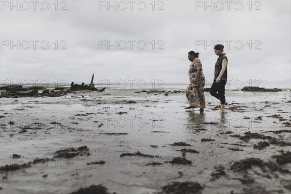 (R-L) Annalena Bärbock (Bündnis 90/Die Grünen), Federal Foreign Minister, and Lavenia McGoon, resident of the Togoru settlement, photographed during a briefing on coastal erosion at a cemetery near the Togoru settlement flooded by rising sea levels, 07.05.2024. Bärbock is travelling to Australia, New Zealand and Fiji for political talks / Photographed on behalf of the Federal Foreign Office