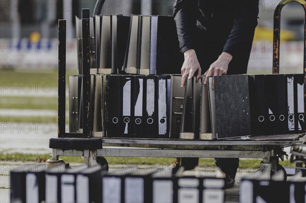 Files are cleared away after a protest action by the German Confederation of Skilled Crafts in front of the Federal Chancellery in Berlin, 26 February 2024. The German Confederation of Skilled Crafts demonstrates against the economic policy of the federal government as well as the high level of bureaucracy and the improvement of location conditions