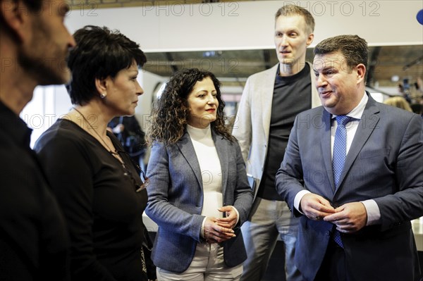 (L-R) Hubertus Heil (SPD), Federal Minister of Labour and Social Affairs, Daniel Terzenbach, Director of Regions at the Federal Employment Agency and Special Representative of the Federal Government, and Cansel Kiziltepe, Senator for Labour, Social Affairs, Equality, Integration, Diversity and Anti-Discrimination in Berlin, in conversation with Valentyna Vysotska, hairdresser from Ukraine, at the Coiffeur Civan hairdressing salon in Berlin, 22.04.2024