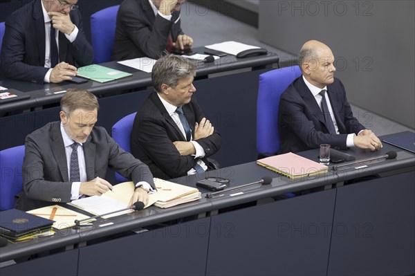 Christian Lindner (FDP), Federal Minister of Finance, Robert Habeck (Alliance 90/The Greens), Federal Minister for Economic Affairs and Climate Protection and Vice-Chancellor, Olaf Scholz (SPD), Federal Chancellor, in the plenary session of the German Bundestag in Berlin, 26 June 2024