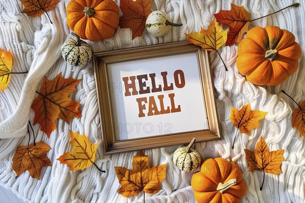 Top view of cozy autumn arrangement with picture frame with text 'Hell fall', pumpkins and colorful leaves. Generative Ai, AI generated