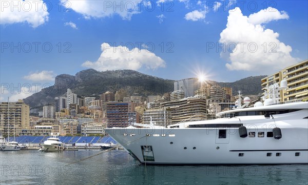 France, French Riviera, Monte Carlo marina with luxury yachts and cars in Monaco bay, Europe