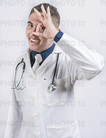 Cheerful doctor gesturing approval isolated. Latin doctor approving on isolated background, Handsome doctor approving and recommending