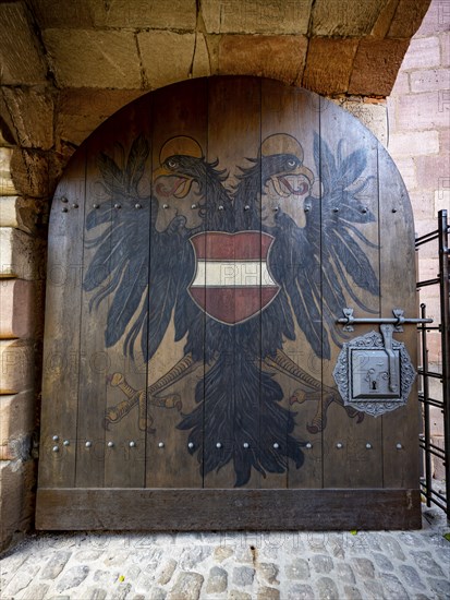 Entrance gate with coat of arms, coat of arms of the city of Nuremberg with double-headed eagle, Kaiserburg, Nuremberg, Middle Franconia, Bavaria, Germany, Europe