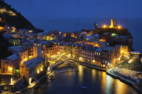 View of Vernazza village popular tourist destination in Cinque Terre National Park a UNESCO World Heritage Site, Liguria, Italy view illuminated in the night from Azure trail