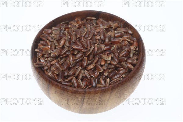 Red rice, Camargue rice from France, rice variety with a red bran layer, usually offered as brown rice, wholemeal product, the rice gets its red colour from the anthocyanin content in its bran layer