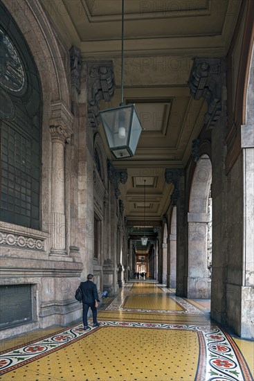 Arcaded walkway with mosaic floor from Palazzo della Borsa, built between 1907 and 1912, in Piazza de Ferrari, Genoa, Italy, Europe